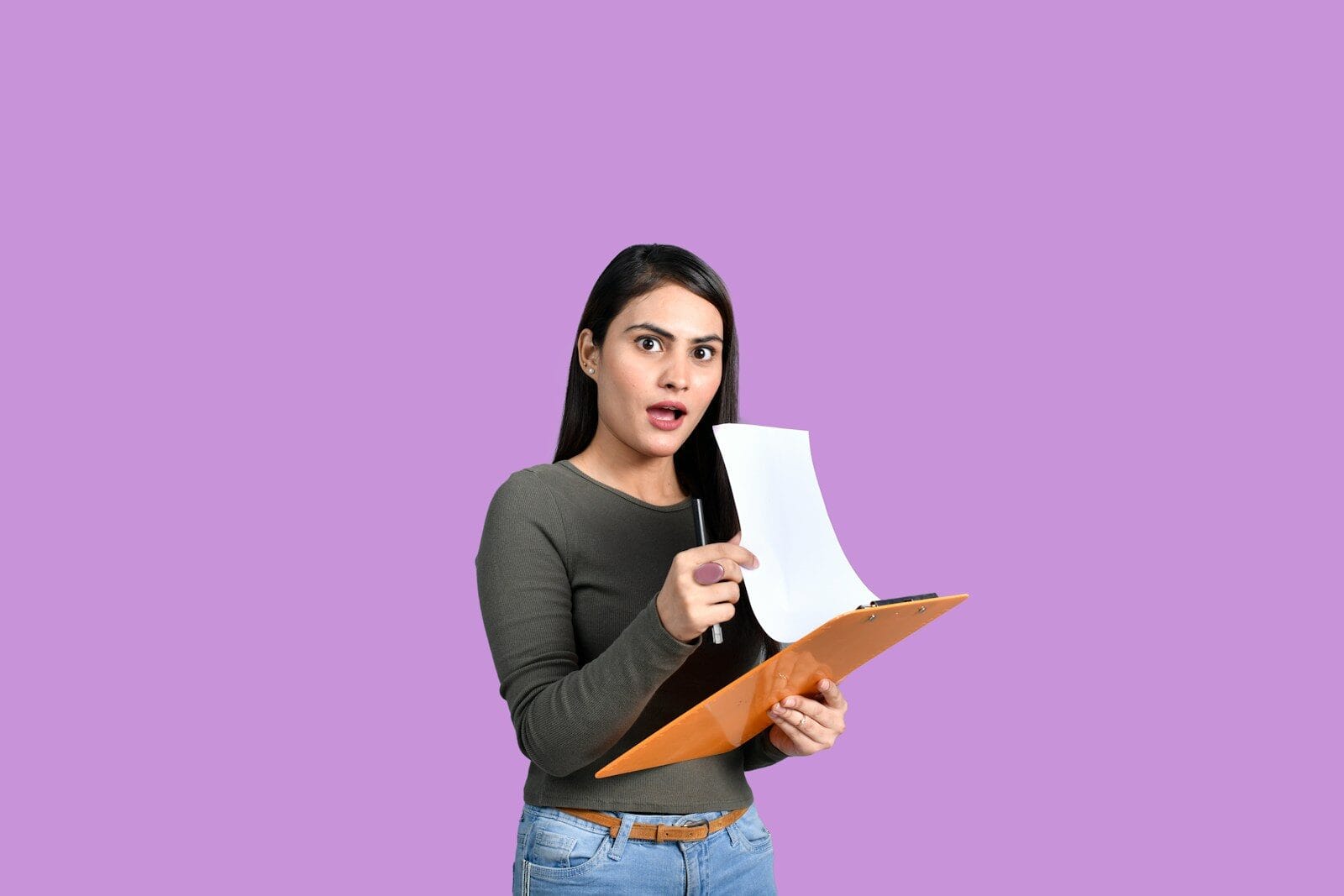 a woman holding a piece of paper